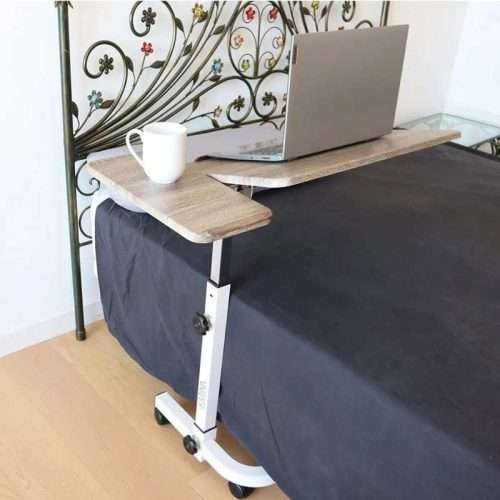 mesa auxiliar con ruedas junto a cama para comer o trabajar
